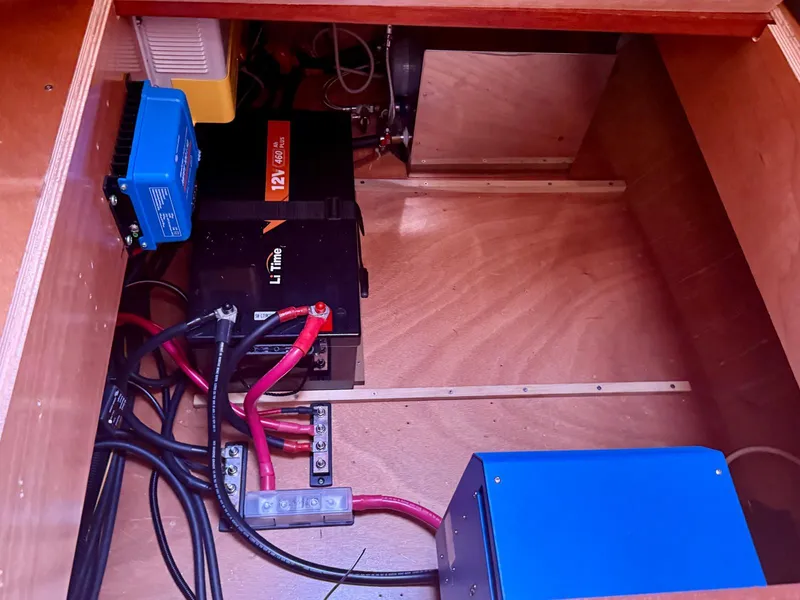 Slide: The Image of Electrical setup inside a 2011 Lagoon 380 S2, featuring LiTime battery and wiring components. - 45