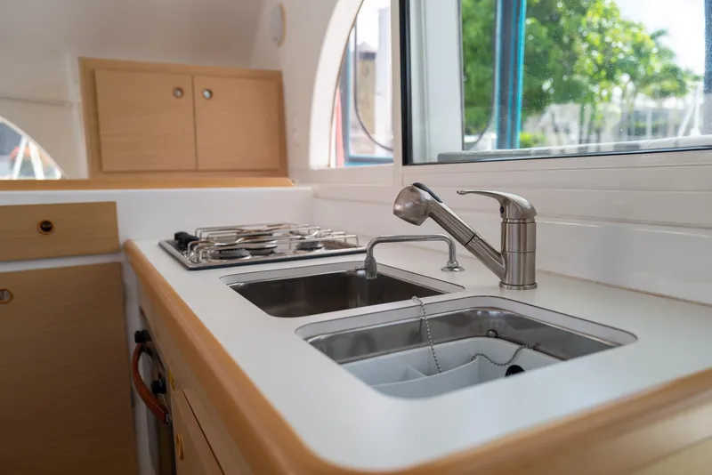 Slide: The Image of Modern kitchen in 2011 Lagoon 380 S2 yacht with sink and stove. - 8