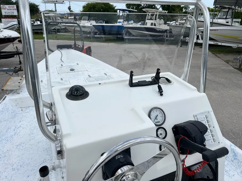 Slide: The Image of 2007 Shallow Stalker V20 boat dashboard with steering wheel and navigation instruments. - 11