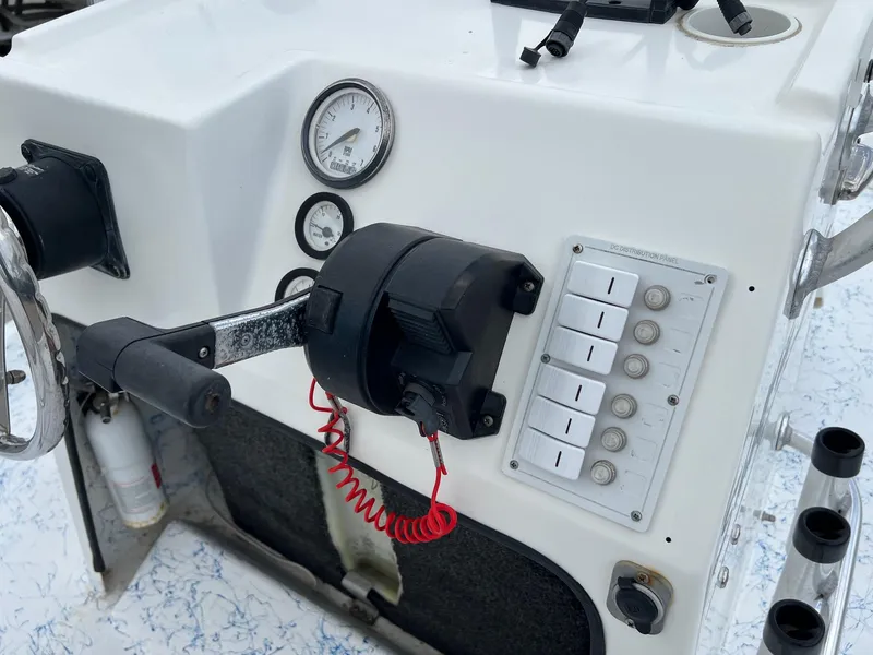 Slide: The Image of Control panel of a 2007 Shallow Stalker V20 boat with gauges and switches. - 13