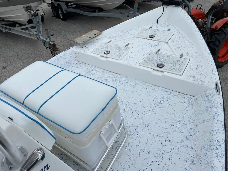 Slide: The Image of 2007 Shallow Stalker V20 boat deck with storage hatches and cushioned seating. - 14
