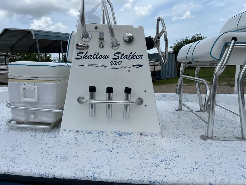 Slide: The Image of 2007 Shallow Stalker V20 boat console with steering wheel and seating. - 4