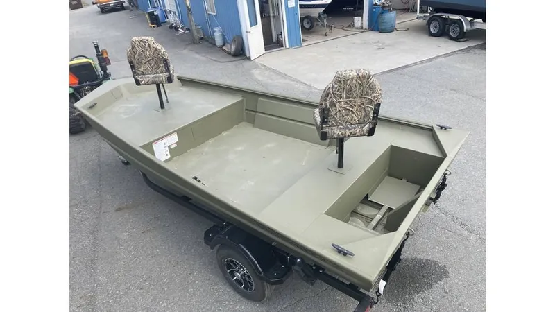 Slide: The Image of 2025 Lowe Roughneck RX1660 Tiller boat with camouflage seats on a trailer. - 7