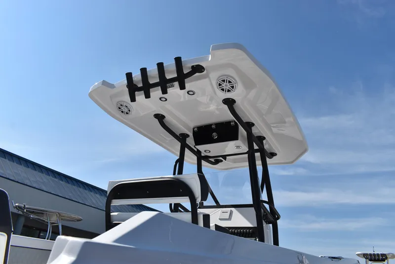 Slide: The Image of 2025 Blackfin 222CC boat with T-top and speakers against a clear blue sky. - 10