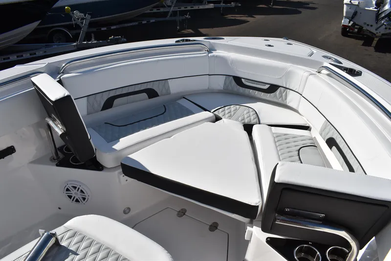Slide: The Image of 2025 Blackfin 222CC boat interior with luxurious white seating and modern design. - 19