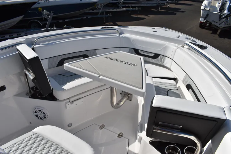 Slide: The Image of 2025 Blackfin 222CC boat interior with seating and table, showcasing luxury design and comfort. - 20
