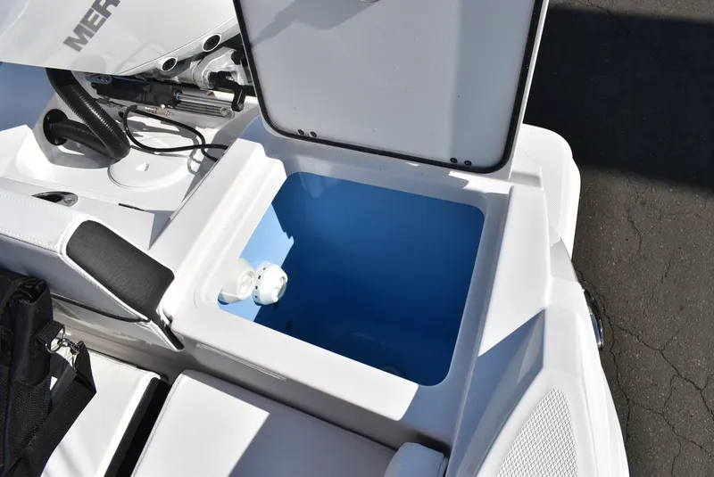 Slide: The Image of Open storage compartment on 2025 Blackfin 222CC boat, showcasing interior space and design. - 21