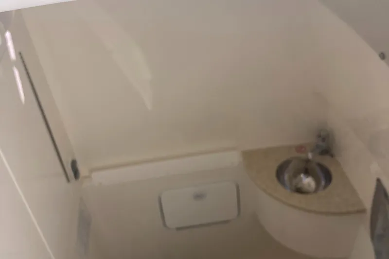 Slide: The Image of Interior of 2018 Regulator 28 Center Console boat with sink and storage. - 10