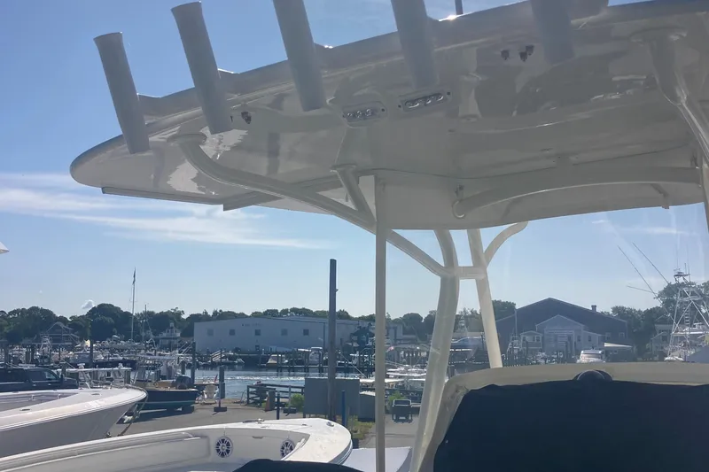 Slide: The Image of 2018 Regulator 28 Center Console boat at marina, featuring Optimus 360 Joystick Control. - 11