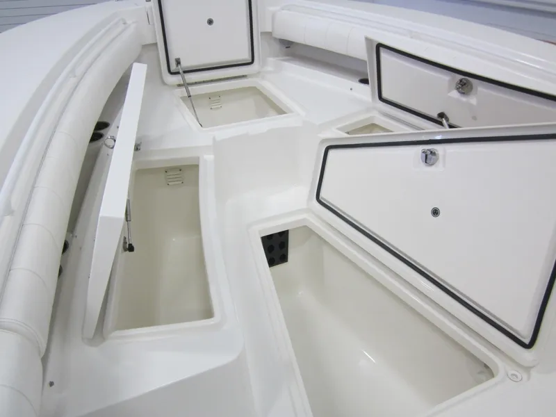 Slide: The Image of 2018 Regulator 28 Center Console storage compartments, showcasing spacious and organized design. - 14