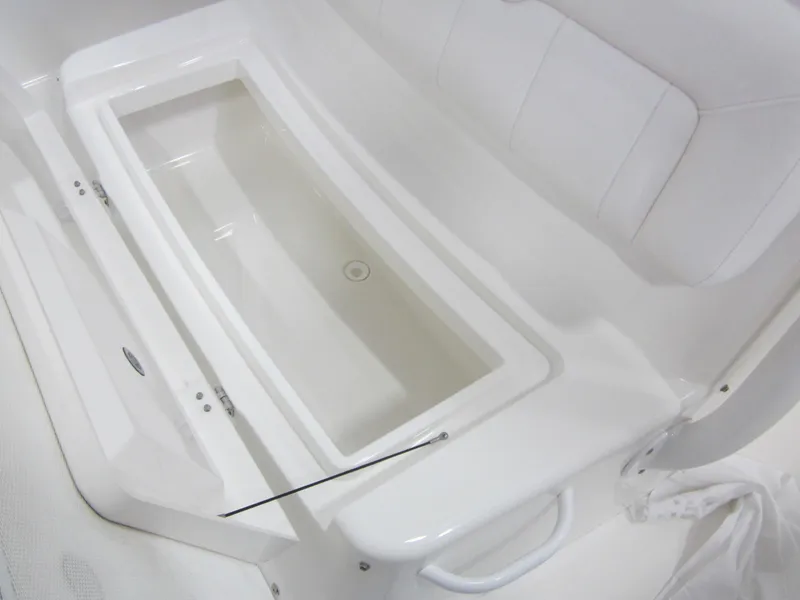 Slide: The Image of 2018 Regulator 28 Center Console interior with seating and storage compartment. - 16