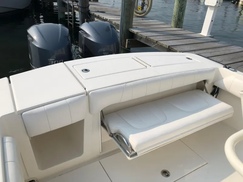 Slide: The Image of 2018 Regulator 28 Center Console with Optimus 360, featuring a fold-down seat. - 18