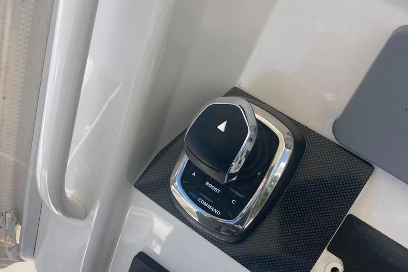 Slide: The Image of 2018 Regulator 28 Center Console Optimus 360 joystick control on boat dashboard. - 21