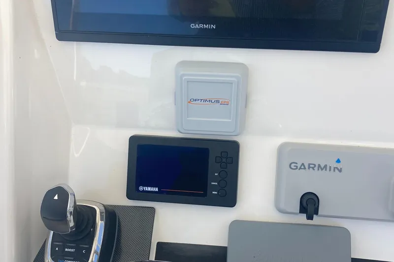 Slide: The Image of 2018 Regulator 28 Center Console dashboard with Optimus 360 Joystick and Garmin controls. - 27