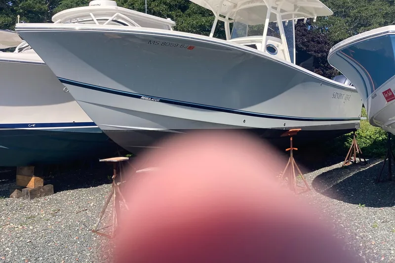 Slide: The Image of 2018 Regulator 28 Center Console boat with Optimus 360 Joystick Control on stands. - 28