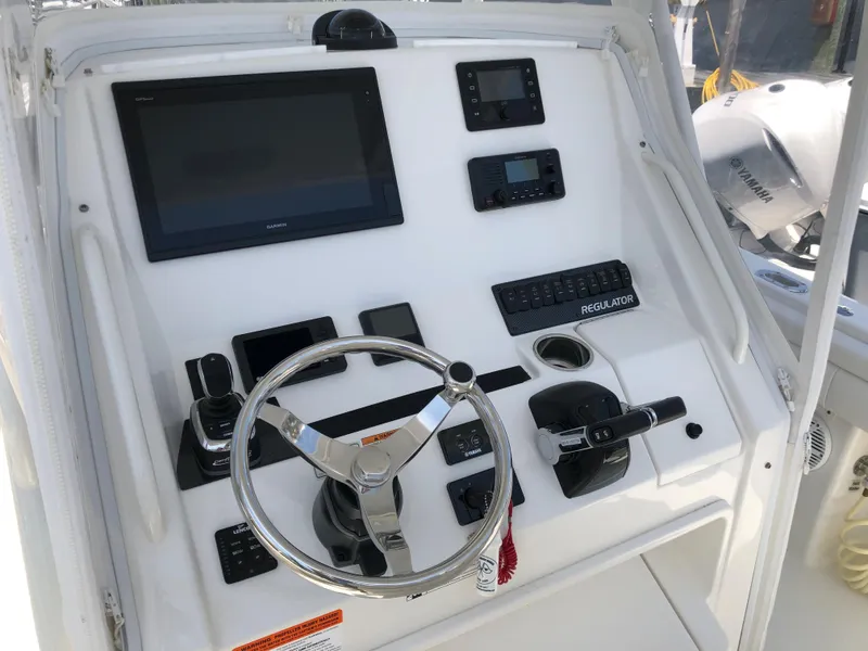 Slide: The Image of 2018 Regulator 28 Center Console dashboard with Optimus 360 Joystick Control. - 4