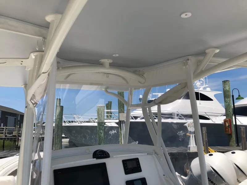 Slide: The Image of 2018 Regulator 28 Center Console with Optimus 360 Joystick Control, docked at marina. - 6