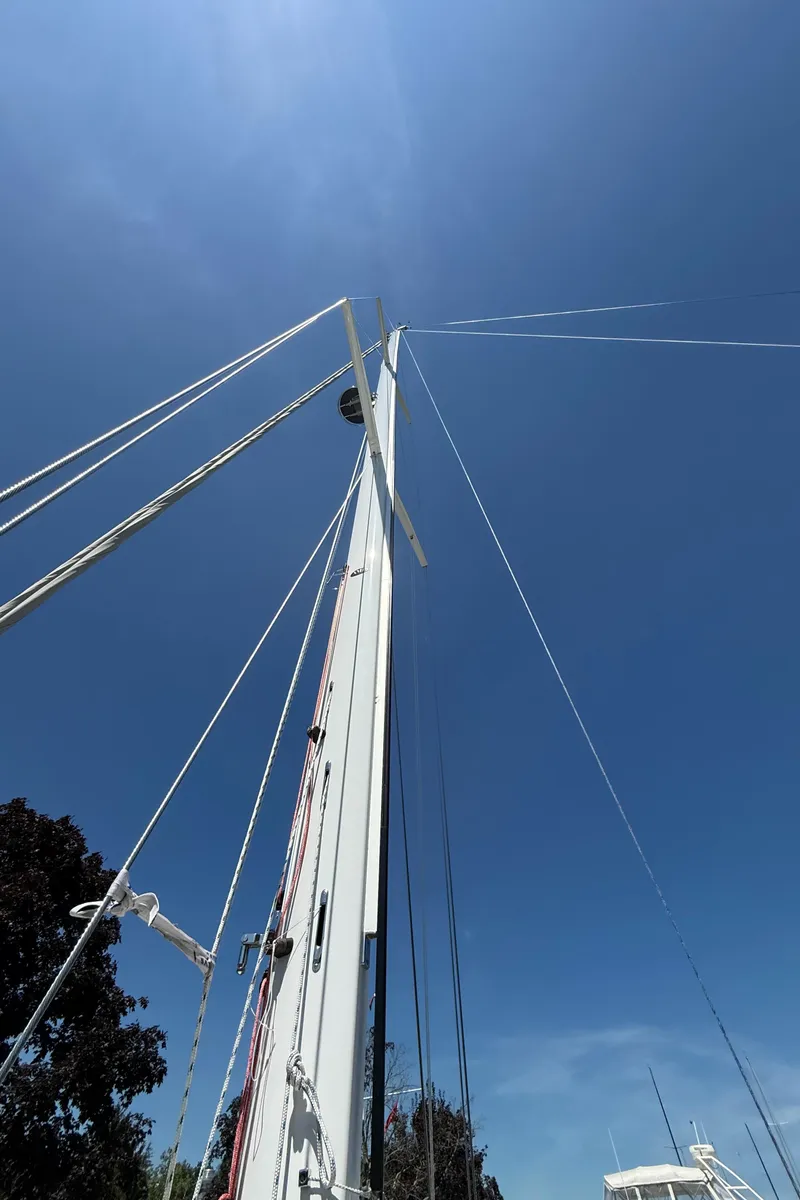 Slide: The Image of Sailboat mast of 2024 Tartan 455 against clear blue sky. - 18