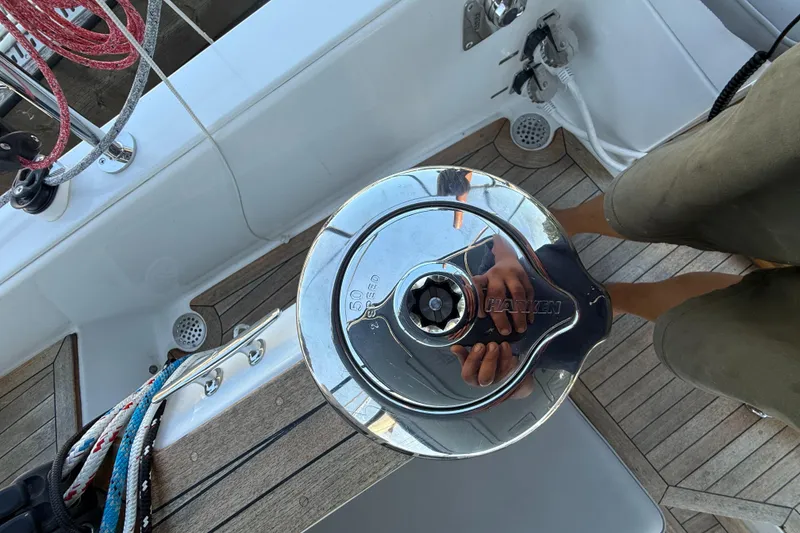 Slide: The Image of 2024 Tartan 455 sailboat deck with Harken winch and colorful ropes. - 26