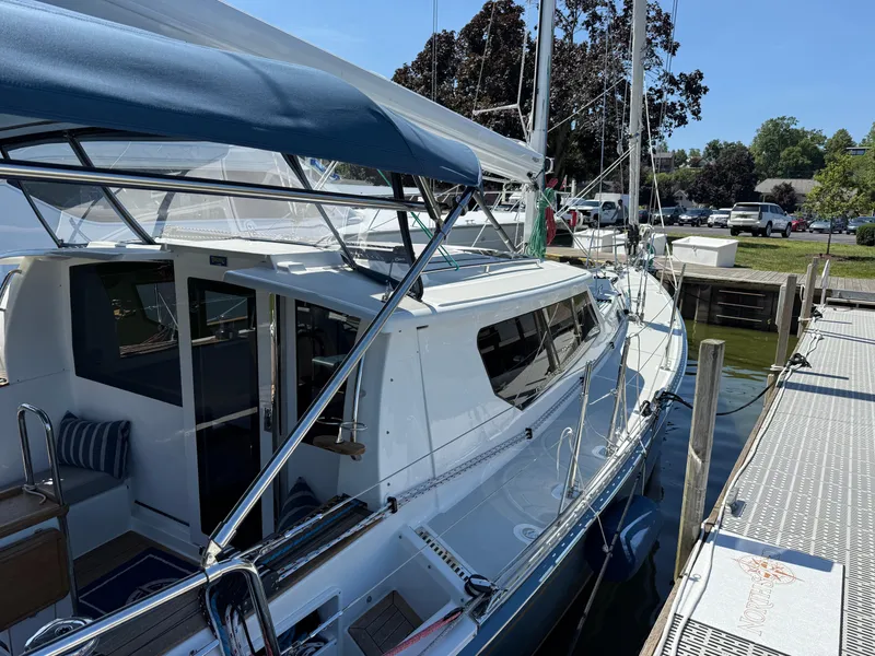 Slide: The Image of 2024 Tartan 455 yacht docked, featuring sleek design and spacious deck area. - 4