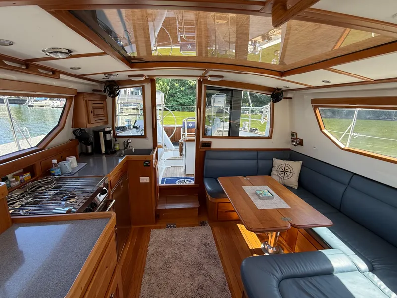 Slide: The Image of Luxurious interior of 2024 Tartan 455 yacht with kitchen and seating area. - 9