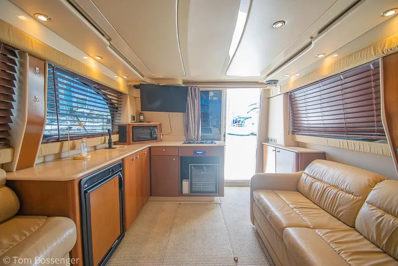 Slide: The Image of Luxurious interior of a 2005 Meridian 341 Sedan yacht with leather seating and modern amenities. - 12