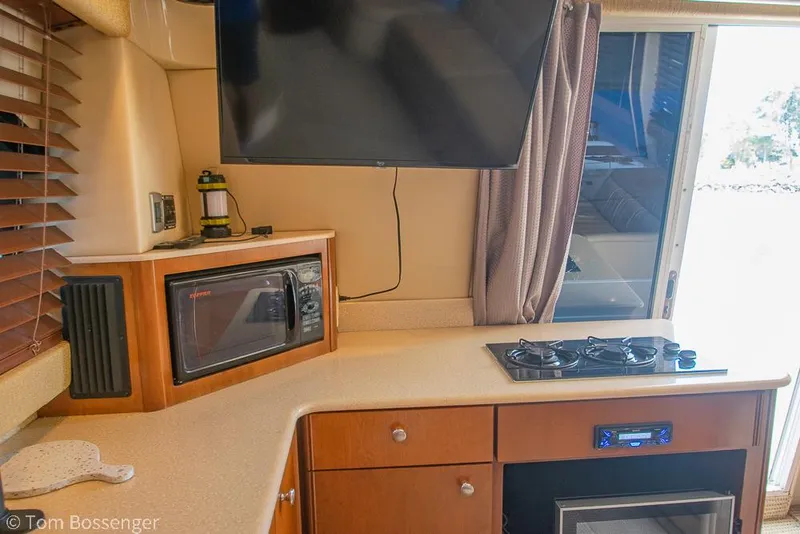 Slide: The Image of Interior of 2005 Meridian 341 Sedan with kitchen appliances and TV. - 15