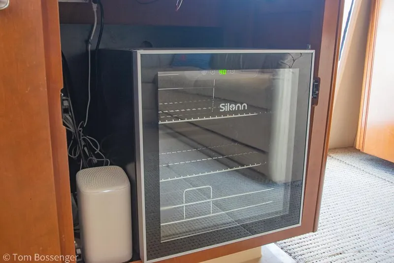 Slide: The Image of Mini fridge inside a 2005 Meridian 341 Sedan yacht cabinet. - 18