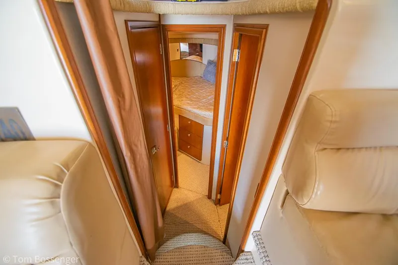 Slide: The Image of Interior view of 2005 Meridian 341 Sedan yacht cabin with wooden doors and cozy bed. - 24