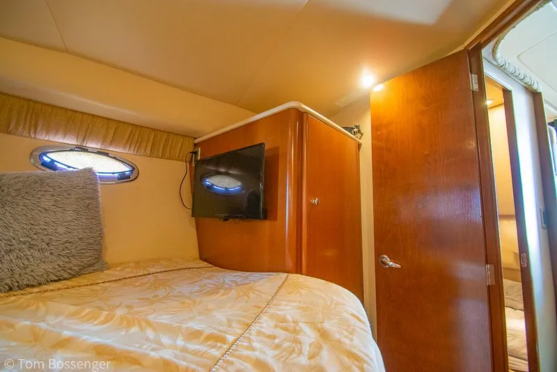 Slide: The Image of Interior of 2005 Meridian 341 Sedan with cozy bed and mounted TV. - 27
