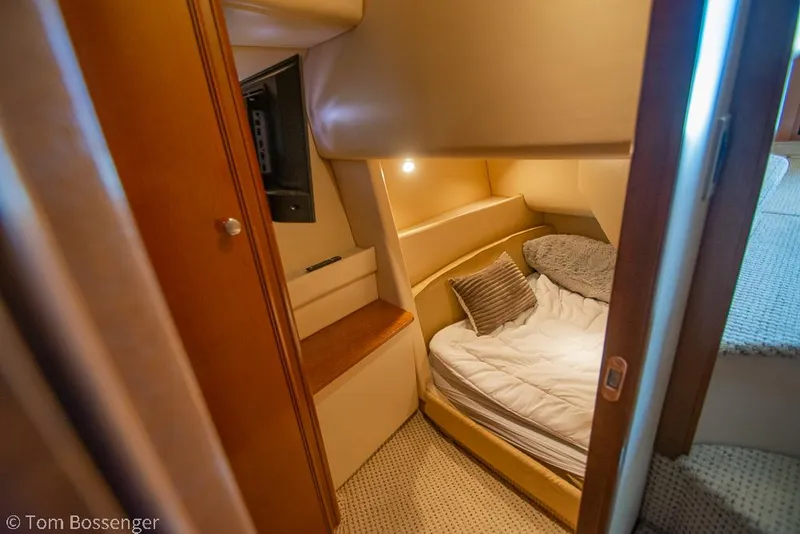 Slide: The Image of Cozy cabin interior of 2005 Meridian 341 Sedan yacht with bed and soft lighting. - 28