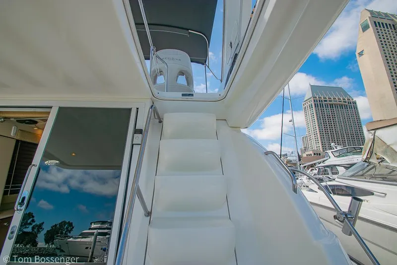 Slide: The Image of Staircase on 2005 Meridian 341 Sedan yacht with city skyline in background. - 36