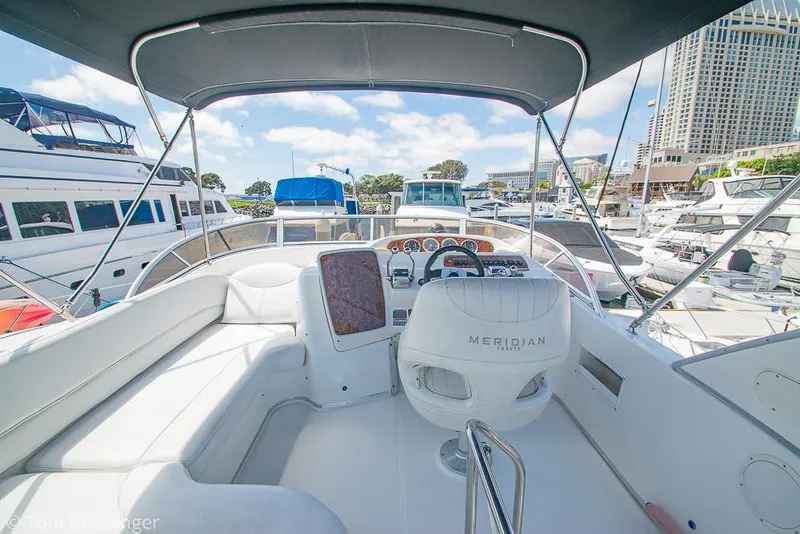 Slide: The Image of 2005 Meridian 341 Sedan yacht interior with helm, docked in marina. - 37