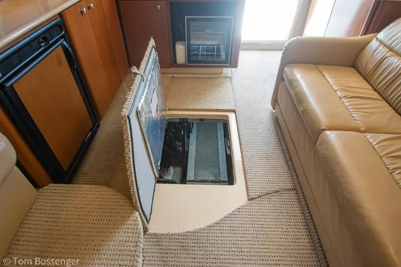 Slide: The Image of 2005 Meridian 341 Sedan interior with open floor hatch, revealing engine compartment. - 47