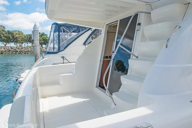Slide: The Image of 2005 Meridian 341 Sedan yacht with sleek white exterior and dockside view. - 5