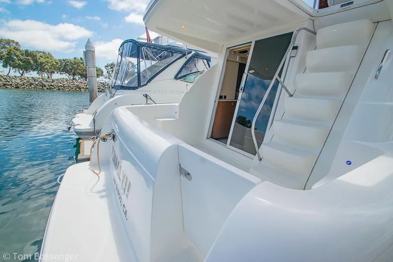 Slide: The Image of 2005 Meridian 341 Sedan yacht docked, featuring sleek design and spacious deck area. - 6