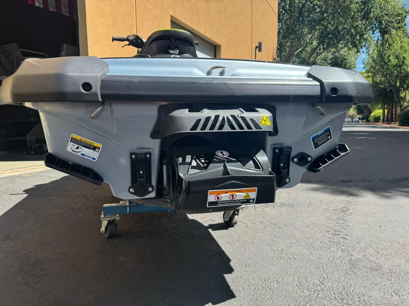 Slide: The Image of 2024 Sea-Doo RXP-X 325 rear view, showcasing jet propulsion system and design details. - 11