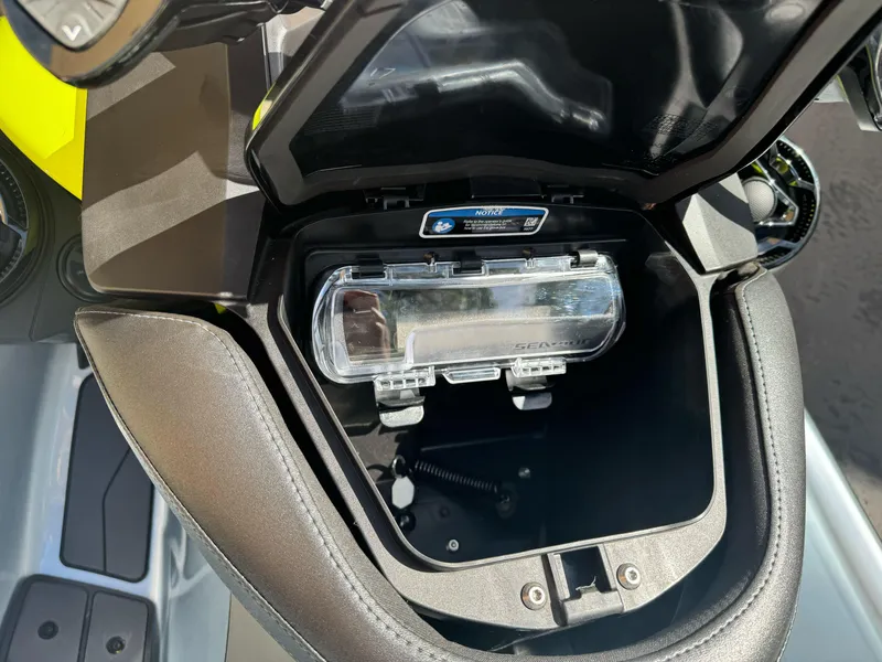 Slide: The Image of 2024 Sea-Doo RXP-X 325 storage compartment with clear cover and interior view. - 5