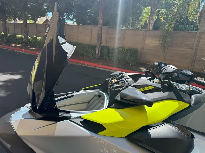 Slide: The Image of 2024 Sea-Doo RXP-X 325 jet ski with open storage compartment, vibrant yellow accents. - 6
