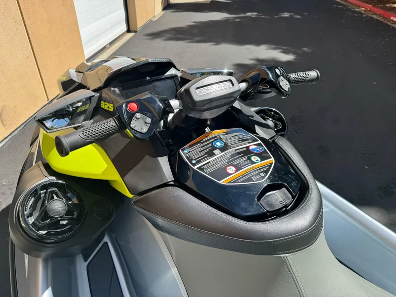 Slide: The Image of 2024 Sea-Doo RXP-X 325 jet ski handlebars and controls, close-up view. - 9