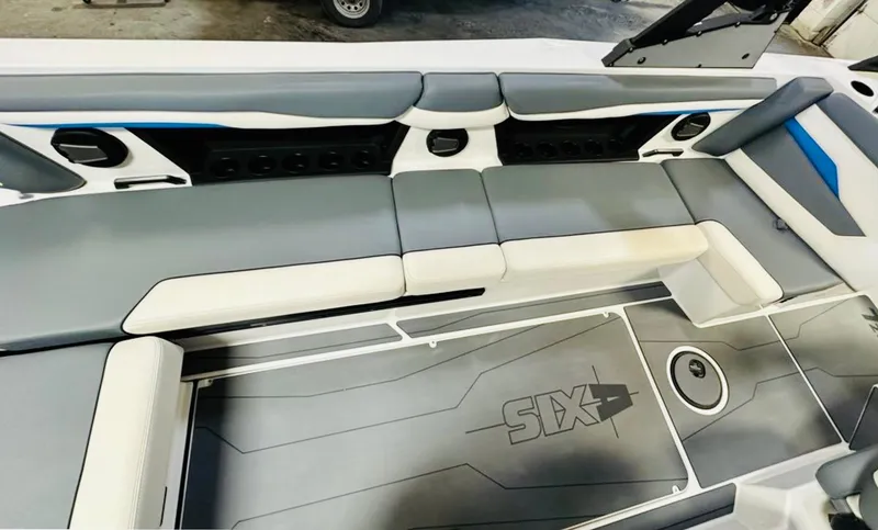 Slide: The Image of 2024 Axis T250 boat interior with gray and white seating, featuring modern design and ample space. - 10