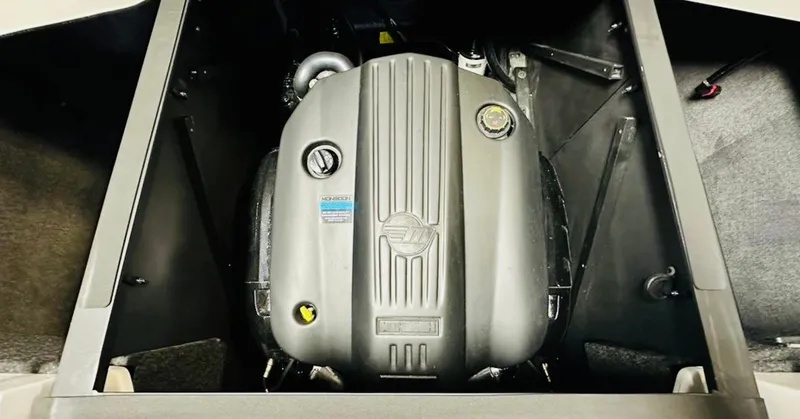 Slide: The Image of 2024 Axis T250 boat interior with gray and blue seating in a workshop setting. - 14