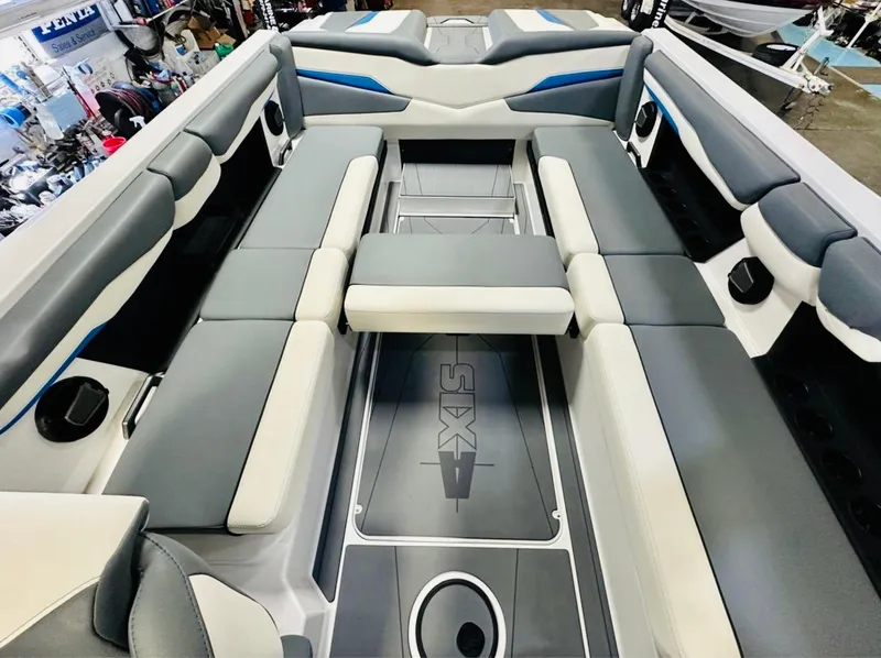 Slide: The Image of 2024 Axis T250 boat interior with gray and white seating, showcasing spacious and modern design. - 9