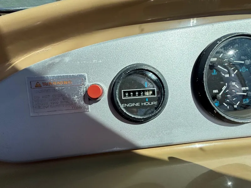 Slide: The Image of Instrument panel of 2001 Carver 350 Mariner showing engine hours and gauges. - 12