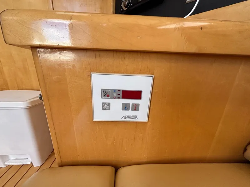 Slide: The Image of Control panel on 2001 Carver 350 Mariner yacht, featuring temperature and fan settings. - 27