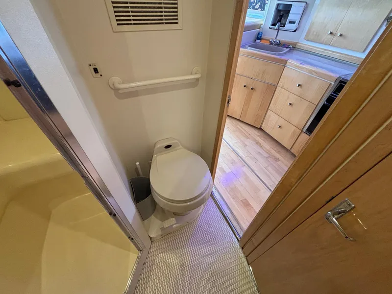 Slide: The Image of 2001 Carver 350 Mariner bathroom and kitchen interior with wooden cabinetry and fixtures. - 29