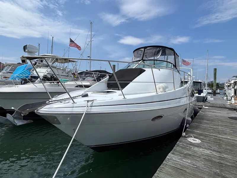 Slide: The Image of 2001 Carver 350 Mariner yacht docked at marina under blue sky. - 3