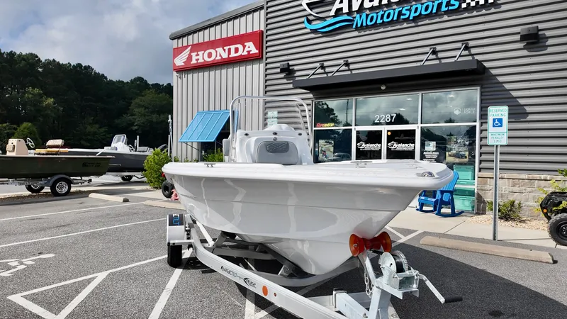Slide: The Image of 2026 ALK2 Powerboats 18 CRS displayed outside Avalanche Motorsports, near Honda sign. - 1