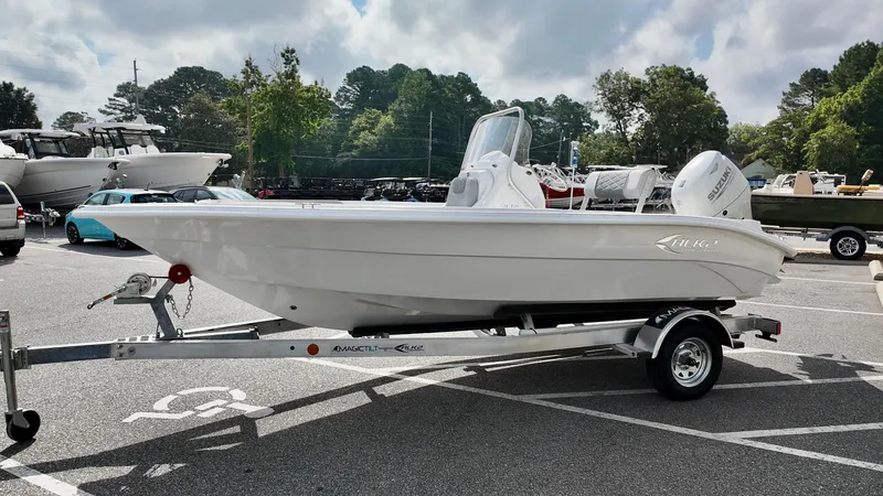 Slide: The Image of 2026 ALK2 Powerboats 18 CRS on trailer in parking lot, surrounded by trees and other boats. - 3