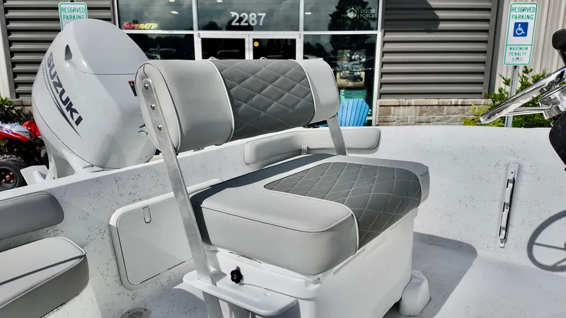Slide: The Image of 2026 ALK2 Powerboats 18 CRS interior with Suzuki engine, featuring gray quilted seating. - 4